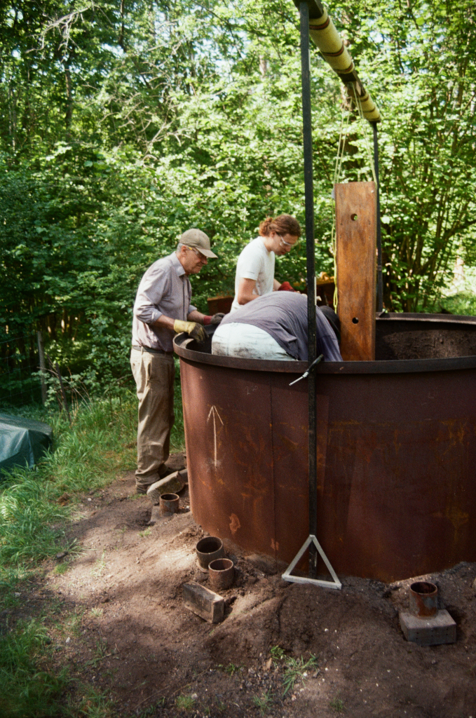 Making charcoal using a charcoal kiln at the Warburg Reserve, Oxfordshire, UK on 26 May 2026. Photo ref: sml-26-May-warburg-fuji-007