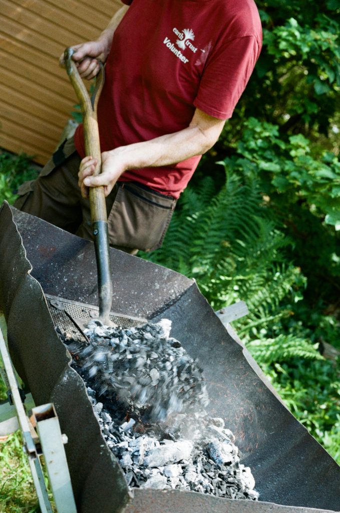 Making charcoal using a charcoal kiln at the Warburg Reserve, Oxfordshire, UK on 26 May 2026. Photo ref: sml-26-May-warburg-kodak-027