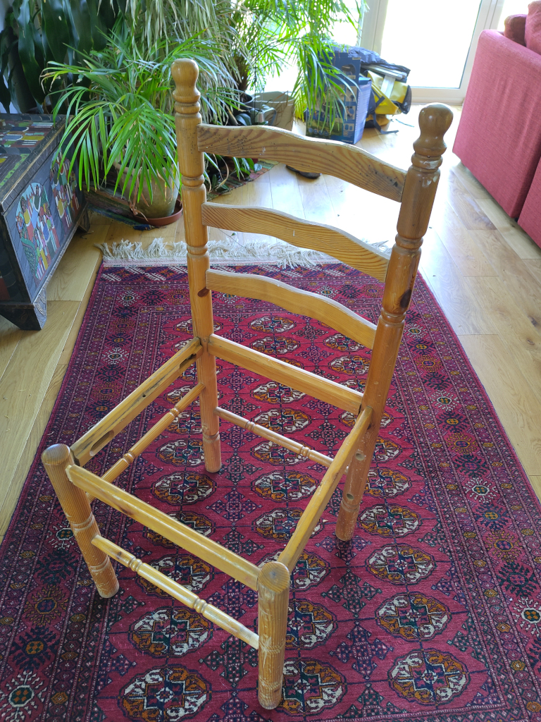 Ready made sculpture: flatpack wooden chair - assembled, prior to firing in a charcoal kiln for Residuals #11. Photo ref: sml-IMG_20260525_143406-Fairphone5